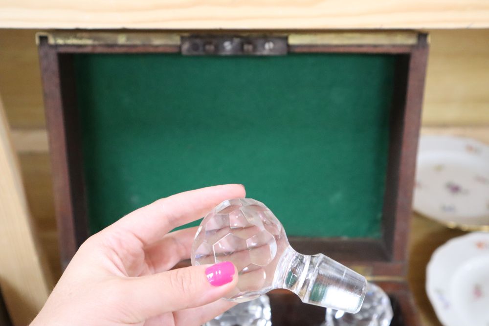 A brass bound six bottle decanter box, containing six cut glass bottles, height 24cm